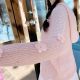 Pink cardigan with flower ornaments