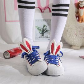 White sneakers with rabbit ears